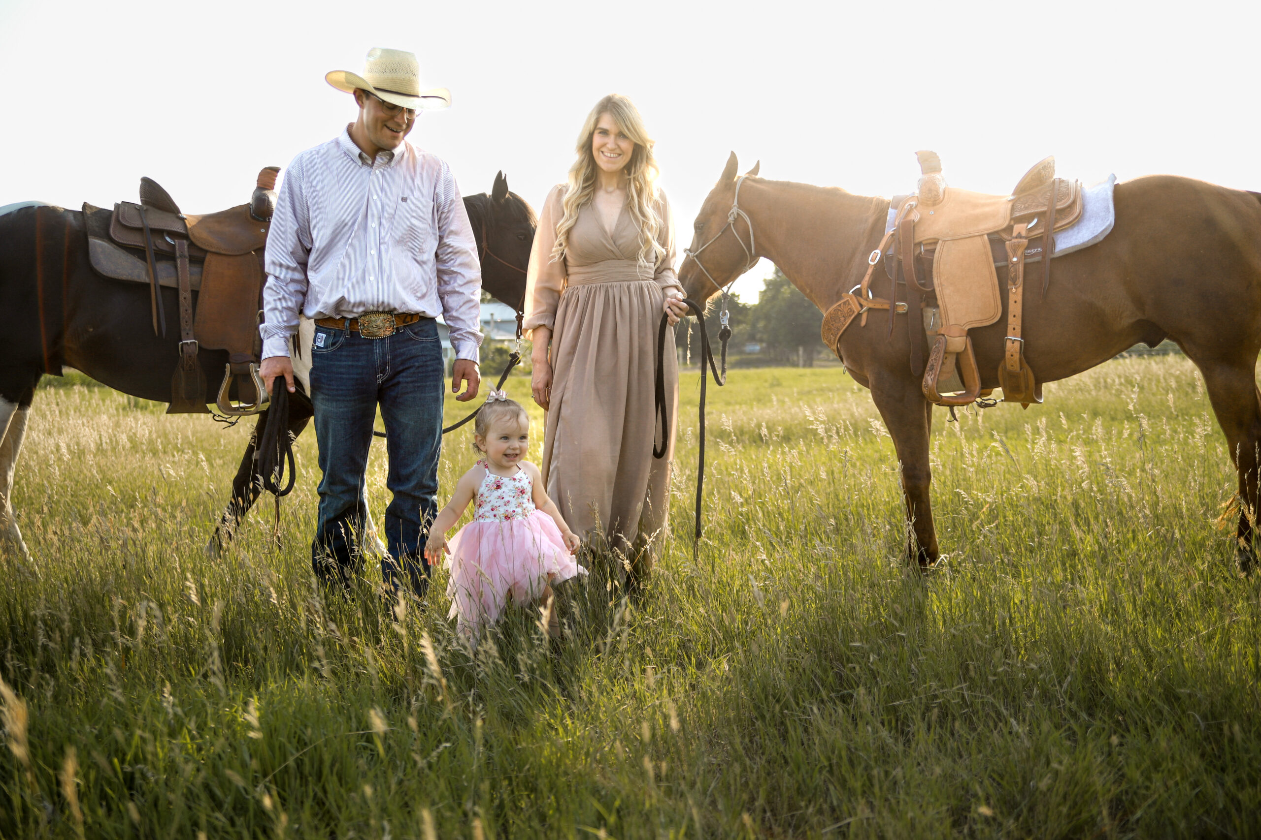 Lexy Tabbert and family in the field with horses